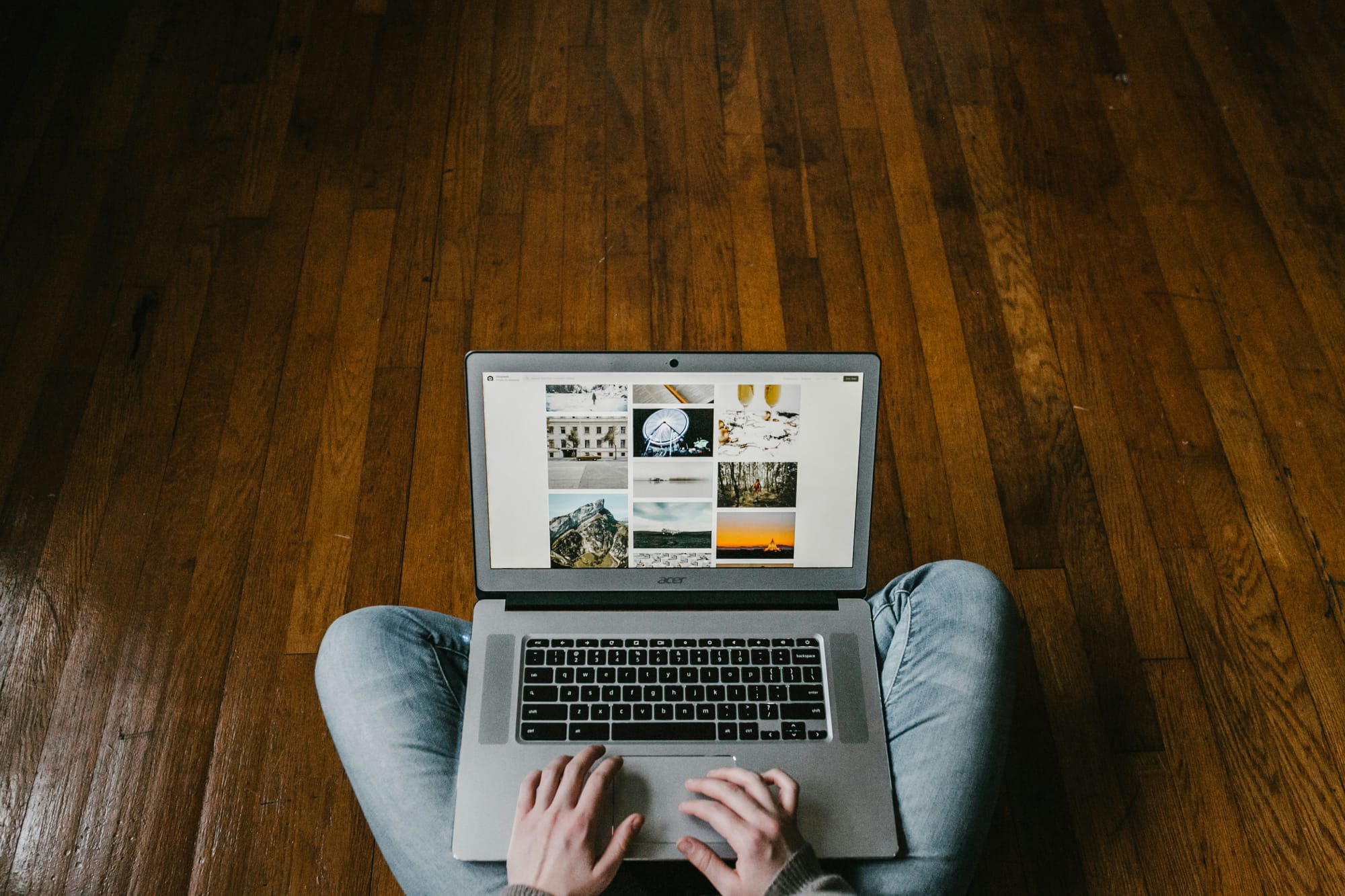 Person browsing photo gallery on a laptop