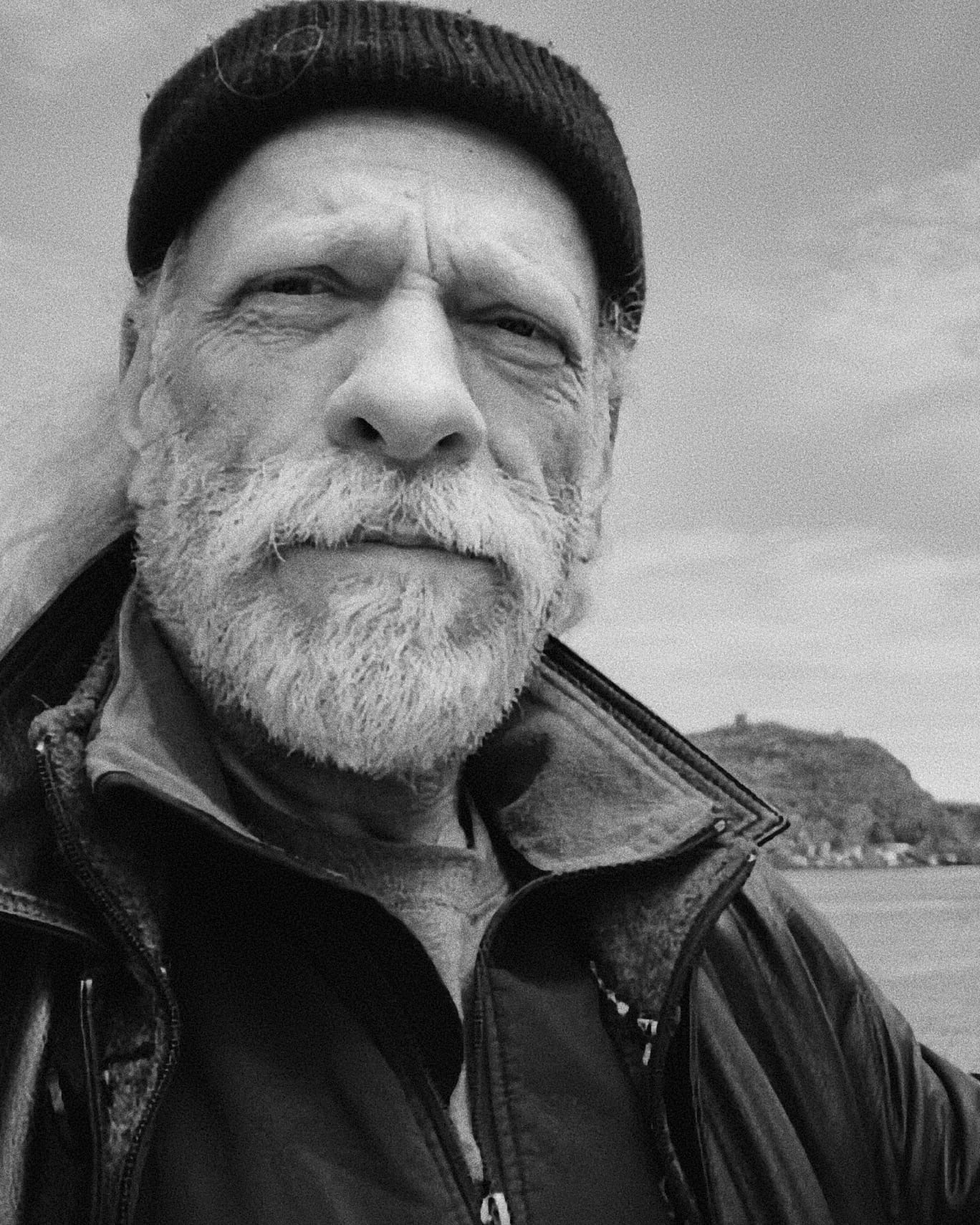 Black and white portrait of folk singer-songwriter John N.A. Brown outdoors