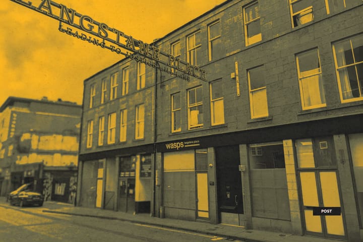 Street view of Langstane Place building with Wasps Studios entrance sign visible.