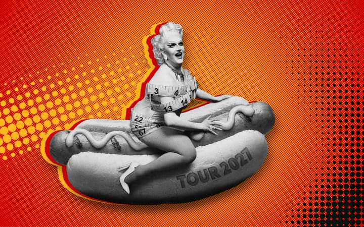 Lawrence Chaney in drag, wrapped in tape measure, sitting on a giant hot dog
