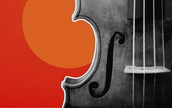 Close-up of a fiddle's f-hole and strings against a red halftone background