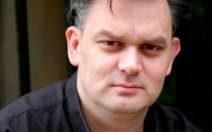Close-up portrait of filmmaker Mark Stirton looking directly at the camera.